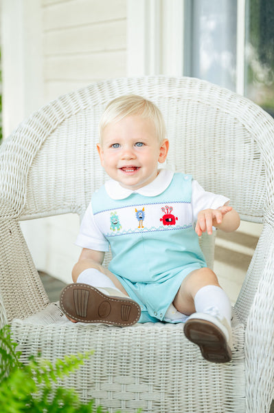 BOY WEARING SMOCKED MONSTERS OUTFIT