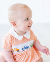 baby boy wearing orange smocked broncos bubble