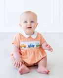 baby boy wearing orange smocked broncos bubble