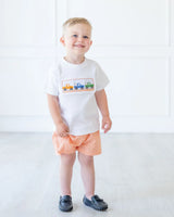 boy wearing smocked broncos t-shirt and shorts set