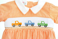 close up of orange smocked broncos bubble