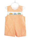 orange smocked broncos jonjon flat lay