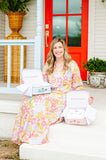 Mom posing with baby gift keepsake boxes blue and pink gingham