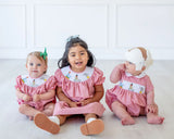 children wearing smocked circus animals outfits