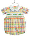 Colorful plaid with cute hand smocked caterpillars on the chest of a boys’ bubble.