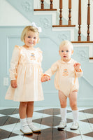 CHILDREN WEARING ORANGE HAND EMBROIDERED HALLOWEEN OUTFITS