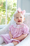 GIRL WEARING SMOCKED PINK GHOSTS BLOOMER SET