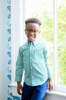 boy wearing green gingham long sleeve button up shirt.