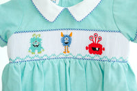 CLOSE UP OF SMOCKED MONSTERS JONJON FOR BOYS