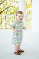 With its charming smocking and bold colors, the smocked Mardi Gras short set is ideal for toddlers embracing the festivities.