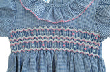 Close up of pink, white and blue hand smocking on blue gingham bloomer set!!