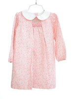 Flat lay of pink floral smocked girl's dress