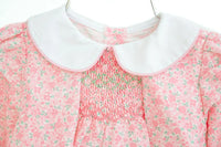 Close up of smocking on pink floral girl's bubble