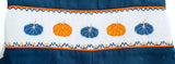 close up of smocked pumpkins on a boy's outfit