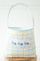 The Blue Smocked Bunnies Easter Basket features colorful pastel plaid fabric, beautifully accented with hand-smocked blue bunnies.