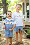 Close-up of two boys outdoors in matching Ruth and Ralph smocked hunting outfits