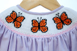 Girl's light purple gingham bloomer set with a hand-smocked orange butterfly neckline and pink details, a timeless back-to-school look