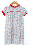 Pima Football Dress for girls in white with game day motif print, red trim, and piping, twirl-ready silhouette