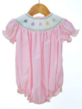 Smocked Rainbow Pumpkins Dress by Ruth and Ralph, pink with smocked pumpkin embroidery, on hanger