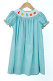Smocked Fall Gourds Dress by Ruth and Ralph, teal gingham with bishop collar, on hanger