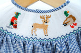 Close-up of smocked hunting embroidery detail on Ruth and Ralph blue gingham Bubble, featuring deer and pheasant