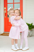 A little girl wearing the Pink Bow Shirt & Leggings Set is sure to stand out with this sweet and stylish look.