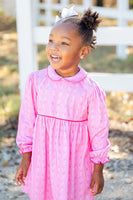 A little girl wearing the Pink Bandana Print Pima Libby Dress looks effortlessly stylish in its soft, playful design.