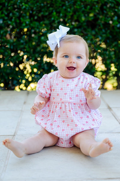 A baby wearing this soft and adorable bubble is ready for Valentine’s Day celebrations or special photos.