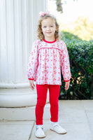 A little girl wearing the Lovely Butterflies Top and Leggings Set looks both playful and stylish in this charming outfit.