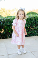 This dress, with its delightful pink plaid and heart details, is sure to be a favorite for your little girl’s wardrobe.