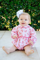 A baby girl in the Butterfly Heart Bubble, her outfit full of charm and comfort.