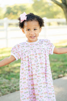 A girl wearing the Pink Cowgirl Toile Pima Catherine Dress will stand out at any occasion with its unique combination of softness and western charm.