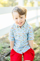 The Blue Cowboy Toile Conrad Button-Up Shirt is a perfect addition to any little boy’s wardrobe, combining comfort, style, and western flair.