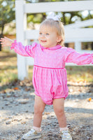 A little girl wearing the Pink Bandana Print Pima Emma Bubble is ready for playdates, photos, or everyday adventures in this adorable outfit.