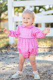 A little girl wearing the Pink Bandana Print Pima Emma Bubble looks sweet and cozy in its soft, long-sleeve design.