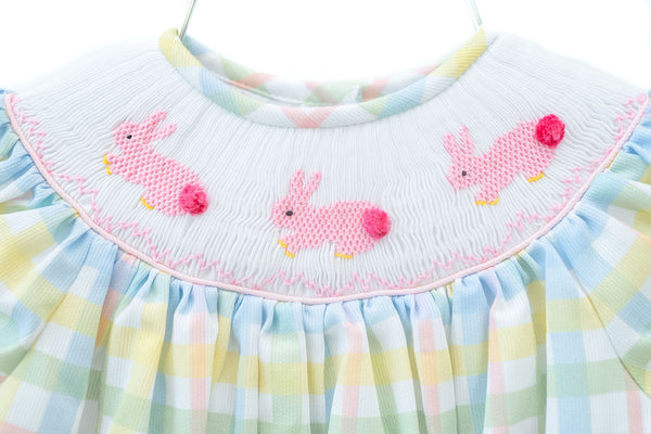 The Smocked Easter Bunnies Dress is a classic, traditional piece perfect for Easter celebrations.