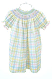 The Pastel Smocked Easter Plaid Dress is made from a soft blend of 65% polyester and 35% cotton, offering both comfort and durability.