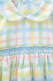 The little boy is wearing the Pastel Smocked Easter Plaid Arthur Bubble, and its cheerful colors are perfect for spring.