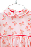 With its delicate heart butterflies and soft pink color, this dress is sure to be a favorite for any season.