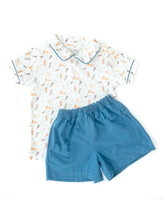 Featuring playful puppy prints on the polo and the classic blue piping, this short set makes a little boy’s outfit fun and fashionable.