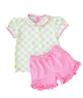 The pink piping on the top perfectly complements the matching pink shorts, making this set as stylish as it is playful.