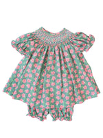 The pink and green smocked bloomer set is available in sizes 3M to 4T, perfect for little ones at any special occasion.