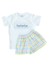 The Smocked Easter Bunnies T-Shirt and Short Set features hand-smocked blue bunnies with cotton tails, adding a sweet, traditional touch.