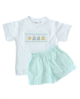 This smocked birthday cake T-shirt with mint green shorts is a festive and timeless outfit for special celebrations.