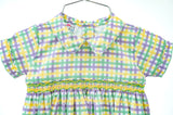 This festive outfit combines timeless plaid design with intricate smocking, perfect for celebrating Mardi Gras in style.