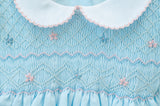 The Classic Blue Smocked Bubble has a Peter Pan collar, adding a touch of charm perfect for Easter.