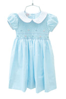 The Classic Blue Smocked Dress has a timeless Peter Pan collar, adding a charming touch to any outfit.