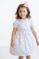 Perfect for toddlers and young girls, the Pima Puppies Dress with pink piping adds a playful, stylish touch to any wardrobe.