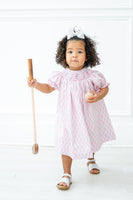 With its classic design and comfortable fit, the Pink Smocked Golf Dress is a must-have for a little golfer’s wardrobe.