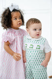 With its classic and fun design, the Smocked Green Golf JonJon is a great choice for a little one who loves golf or just loves to look sharp.